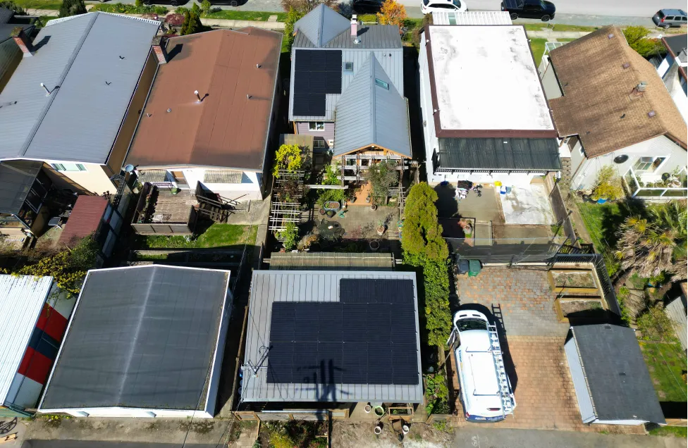 Top-down view of a custom solar panel layout on a shingled roof in British Columbia, showcasing professional craftsmanship and modern energy design.