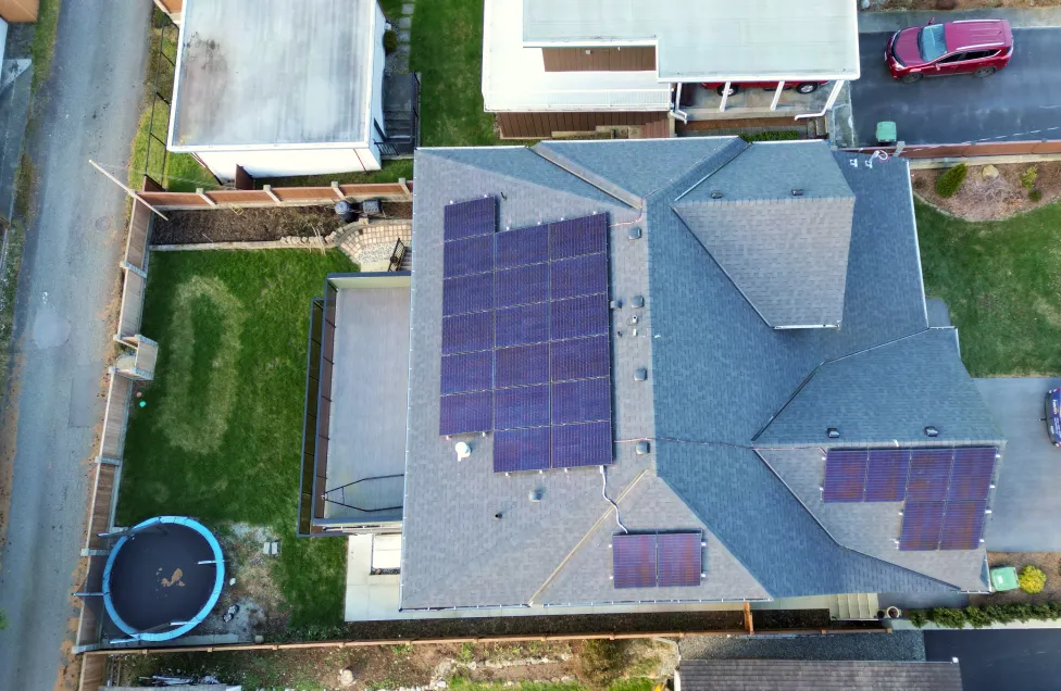 Aerial view of a high-efficiency residential solar panel array on a BC home, demonstrating a clean and professional installation by Polaron Solar.